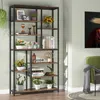 A tall, multi-shelf bookcase filled with decorative items and plants, placed in a room next to a green armchair. Podgląd zdjęcia produktu
