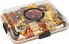 A charcuterie board filled with various snacks, cheeses, meats, fruits, and crackers, covered by a clear plastic lid. Produktbild-Vorschau