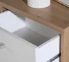 Close-up view of an open drawer in a piece of furniture, showing the interior and drawer slides. Produktbild-Vorschau
