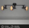 A black track light fixture with three adjustable spotlights, each with a gold interior, mounted on a ceiling. Produktbild-Vorschau