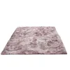 A fluffy, shaggy rug with a gradient of pink and gray colors, laid flat on a white background. Anteprima dell’immagine prodotto