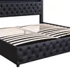 A close-up view of a black upholstered bed frame with a slatted mattress support system. Produktbild-Vorschau
