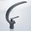 A black modern faucet on a white and light gray background. Podgląd zdjęcia produktu