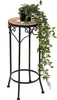 A potted plant with trailing vines sits on a decorative mosaic-topped plant stand. Produktbild-Vorschau