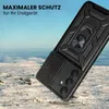 A black phone case with a ring holder is shown in a snowy, outdoor environment. Produktbild-Vorschau