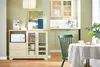 A kitchen or dining area with a buffet cabinet, microwave, coffee maker, and a dining table with a chair. Voir les images du produit