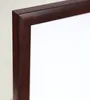 A close-up view of the corner of a mahogany-colored picture frame with a white matting. Produktbild-Vorschau