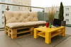 A balcony setting with a pallet sofa and coffee table, featuring a laptop and drinks. Anteprima dell’immagine prodotto