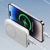 A white power bank is attached to the back of a smartphone, charging it wirelessly. The phone screen displays a charging animation and text. Náhľad obrázku produktu