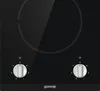 A close-up, top-down view of a black Gorenje electric stovetop with two silver control knobs. Produktbild-Vorschau