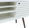 A close-up view of a white media console with wooden legs and a slatted door. Produktbild-Vorschau