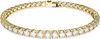 A close-up studio shot of a gold tennis bracelet with clear stones. Anteprima dell’immagine prodotto
