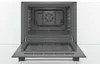 An open oven with a glass door lowered, showing the interior and the fan. Produktbild-Vorschau