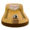 A miniature wooden bowling alley with a silver ball and pins. Produktbild-Vorschau