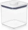A clear, studio shot of a square, clear plastic food storage container with a white lid and a blue seal. Náhled obrázku produktu