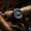A black G-Shock watch is resting on a rusty metal pipe. Náhled obrázku produktu
