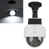 A solar-powered fake security camera with a dome lens and LED lights. Produktbild-Vorschau