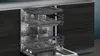 The interior of a dishwasher with its racks pulled out. Produktbild-Vorschau