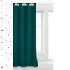 A single teal curtain hanging in front of a window. Produktbild-Vorschau