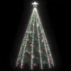 A decorated Christmas tree with lights and ornaments against a black background. Náhled obrázku produktu