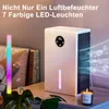 A humidifier with LED lighting on a table next to a bed. Produktbild-Vorschau