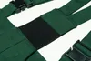 A close-up view of dark green suspenders with a black elastic section. Náhled obrázku produktu