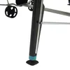 A close-up view of the leg and wheel of an outdoor table tennis table. Produktbild-Vorschau