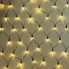 A close-up view of a net light string with warm white LED lights against a light gray background. Náhled obrázku produktu