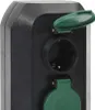 A close-up view of a black outdoor electrical outlet with green protective covers. Anteprima dell’immagine prodotto