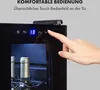 A hand is shown interacting with the touch control panel of a wine cooler, with bottles visible inside. Podgląd zdjęcia produktu