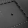 A close-up view of a black textured surface with a central black screw or fastener. Náhľad obrázku produktu