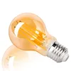 A single amber glass LED light bulb with a silver screw base is shown against a white background. The filament-like LED elements are visible inside the bulb. Náhled obrázku produktu
