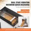 A close-up view of a dual-stage vibration motorfor quick discharge machine, showing a tray filled with small, light-brown particles, and a chute where the particles are being dispensed. Náhľad obrázku produktu