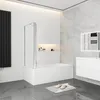 A modern bathroom with a bathtub, shower screen, vanity, and mirror. Produktbild-Vorschau
