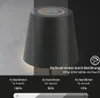 A dark gray table lamp with a touch-sensitive top displaying a color spectrum and a power icon, shown with a gradient background and text explaining its dimming features. Anteprima dell’immagine prodotto