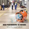 Workers in a factory setting with a portable industrial fan. Podgląd zdjęcia produktu