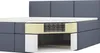A cutaway view of a grey upholstered bed with a visible mattress spring system, showing its internal structure, and storage drawers underneath. Produktbild-Vorschau