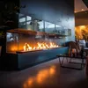 A modern living room with a long, glass-enclosed ethanol fireplace. Produktbild-Vorschau
