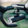 A bicycle handlebar with a Garmin device and a front light attached. Produktbild-Vorschau
