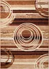 A close-up view of a rug with a modern abstract design. Produktbild-Vorschau