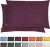 A collage of pillowcases in various colors, with a main image showing two purple pillowcases. Produktbild-Vorschau