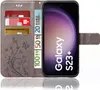 A grey flip case for a Samsung Galaxy S23 Plus phone, showing credit cards and Euro banknotes inserted into the case. Produktbild-Vorschau