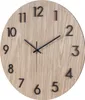 A close-up view of a round wooden wall clock with black hour markers and hands. Anteprima dell’immagine prodotto