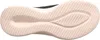 The sole of a black and white sneaker is shown from an underneath view against a white background. Náhľad obrázku produktu