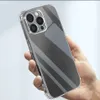 A hand holding a clear phone case on a light gray background. Produktbild-Vorschau