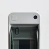 A close-up view of the top of a gray electrical distribution box. Anteprima dell’immagine prodotto