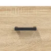 A close-up view of a black handle on a wooden surface. Produktbild-Vorschau