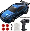 A blue remote control drift car with accessories laid out around it. Podgląd zdjęcia produktu