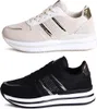 Two pairs of women's platform sneakers, one white and one black, displayed side-by-side. Produktbild-Vorschau