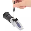 A hand is using a small screwdriver to adjust a refractometer. Náhled obrázku produktu